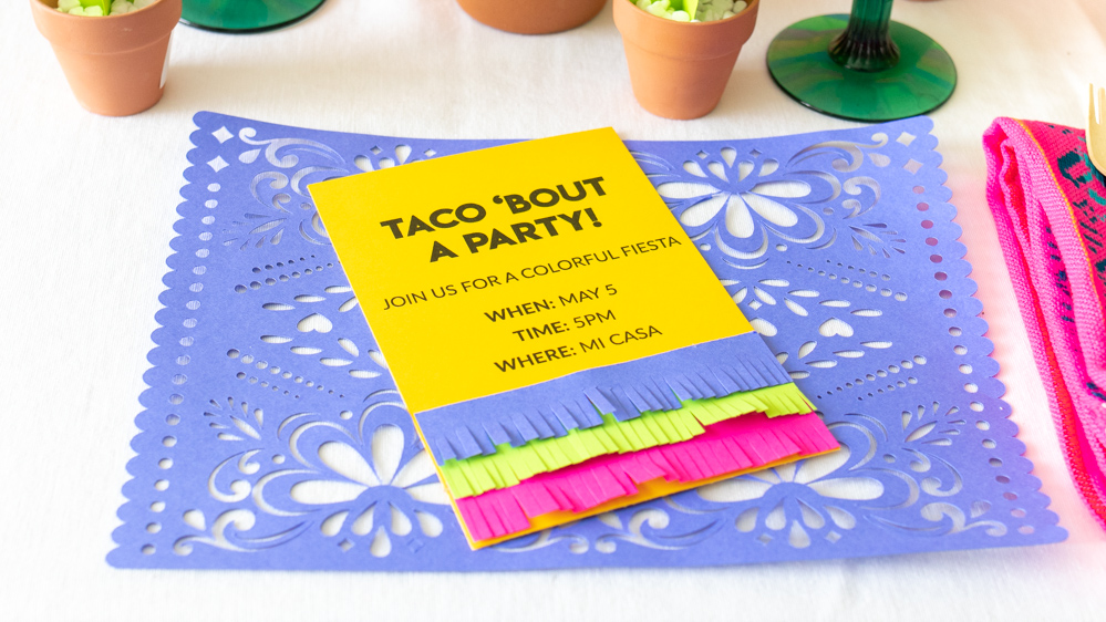 paper fringe invitation on paper placemat