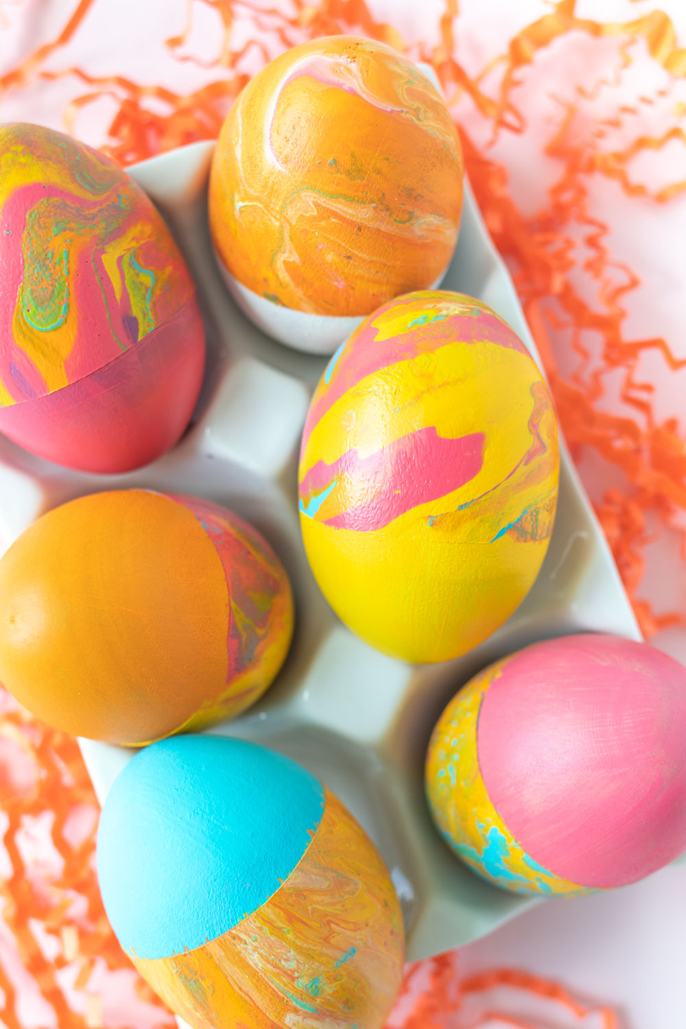 closeup of yellow and marbled easter egg