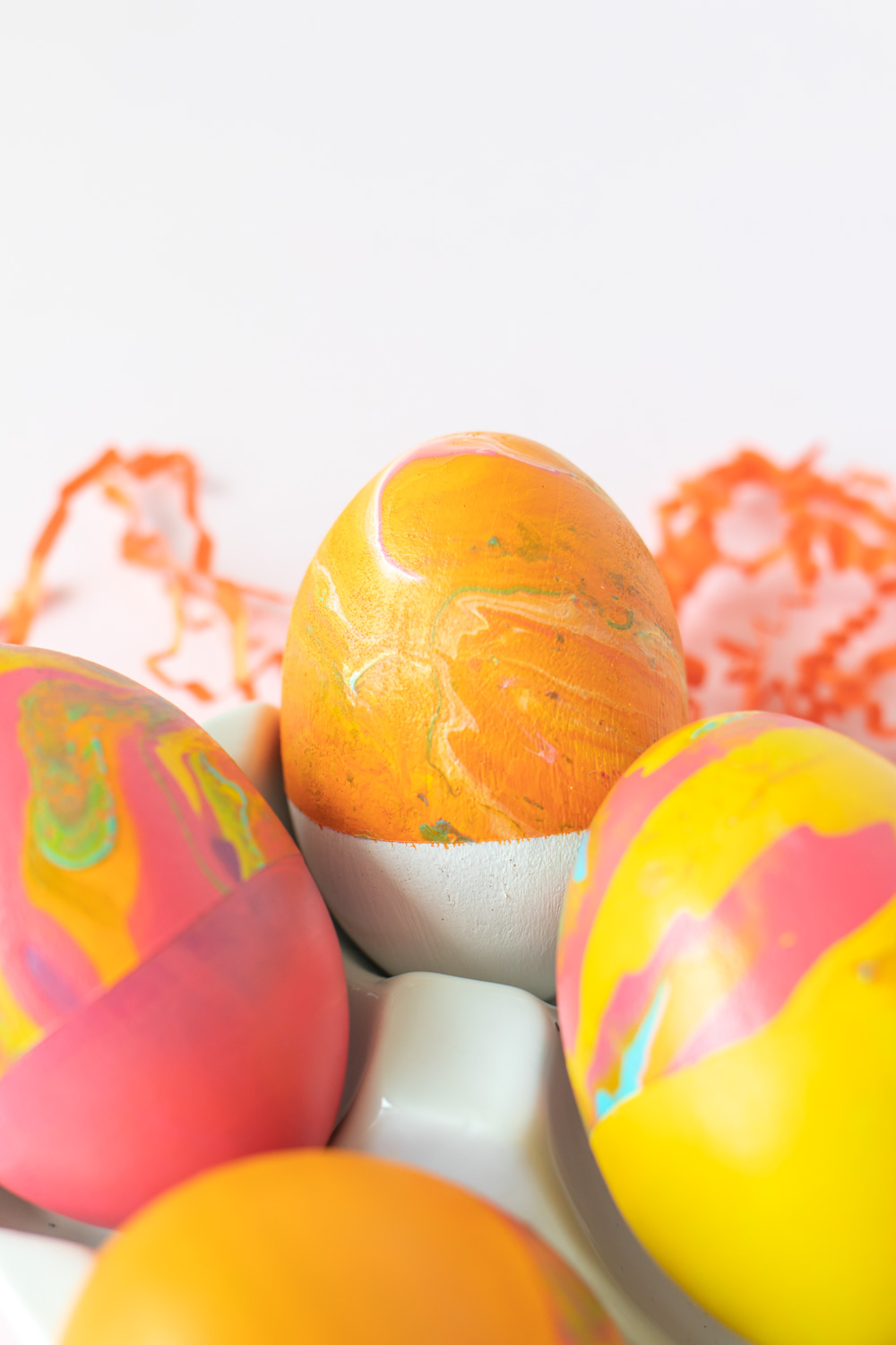 closeup of marbled egg with white and orange colors