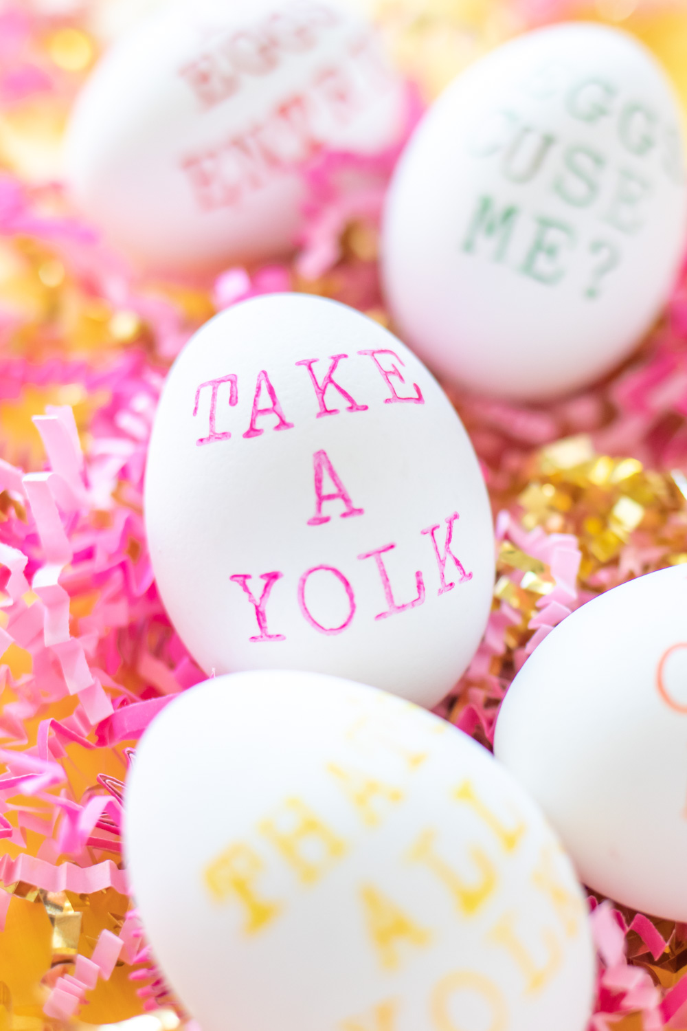 punny easter egg that says "take a yolk"