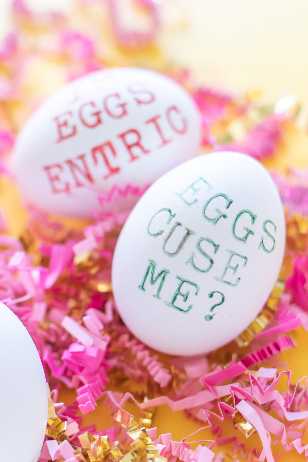 closeup of easter egg pun in green text
