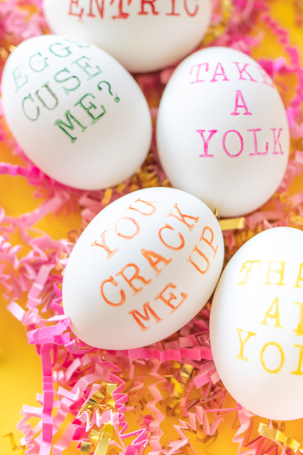 closeup of hand stamped easter egg in orange