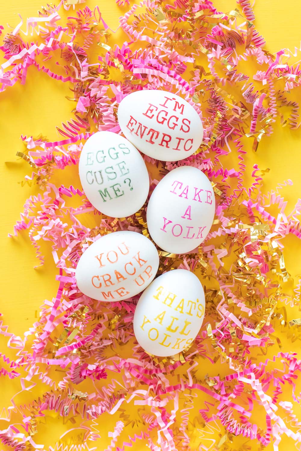 five punny easter eggs on crumpled paper