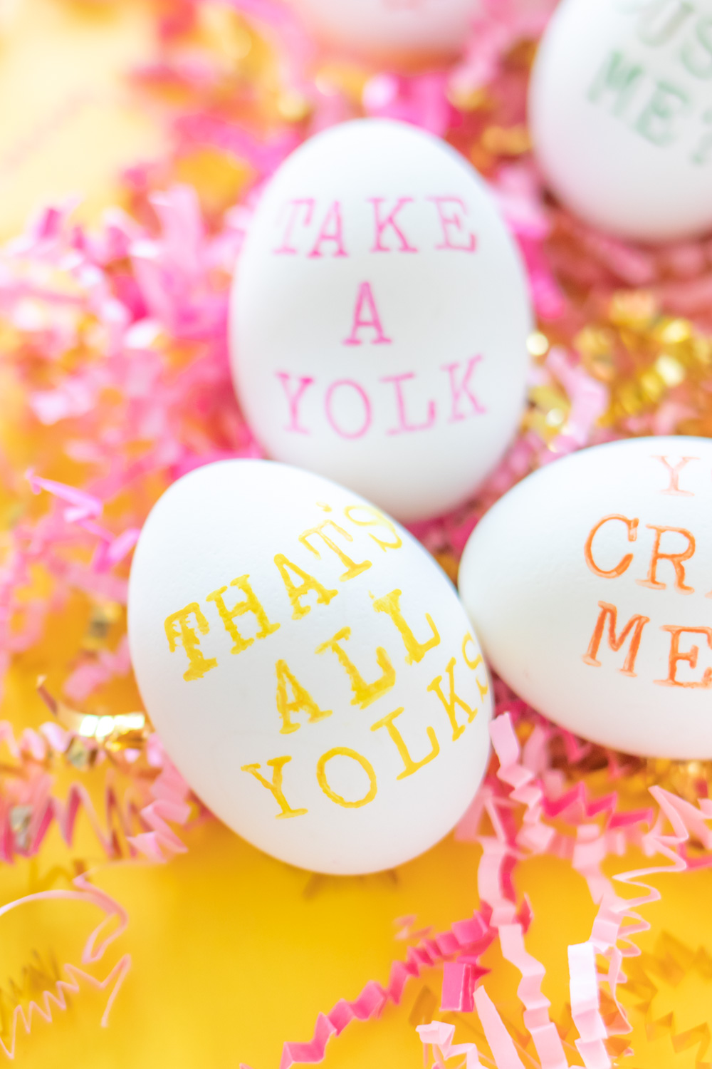easter egg with punny saying on bed of paper
