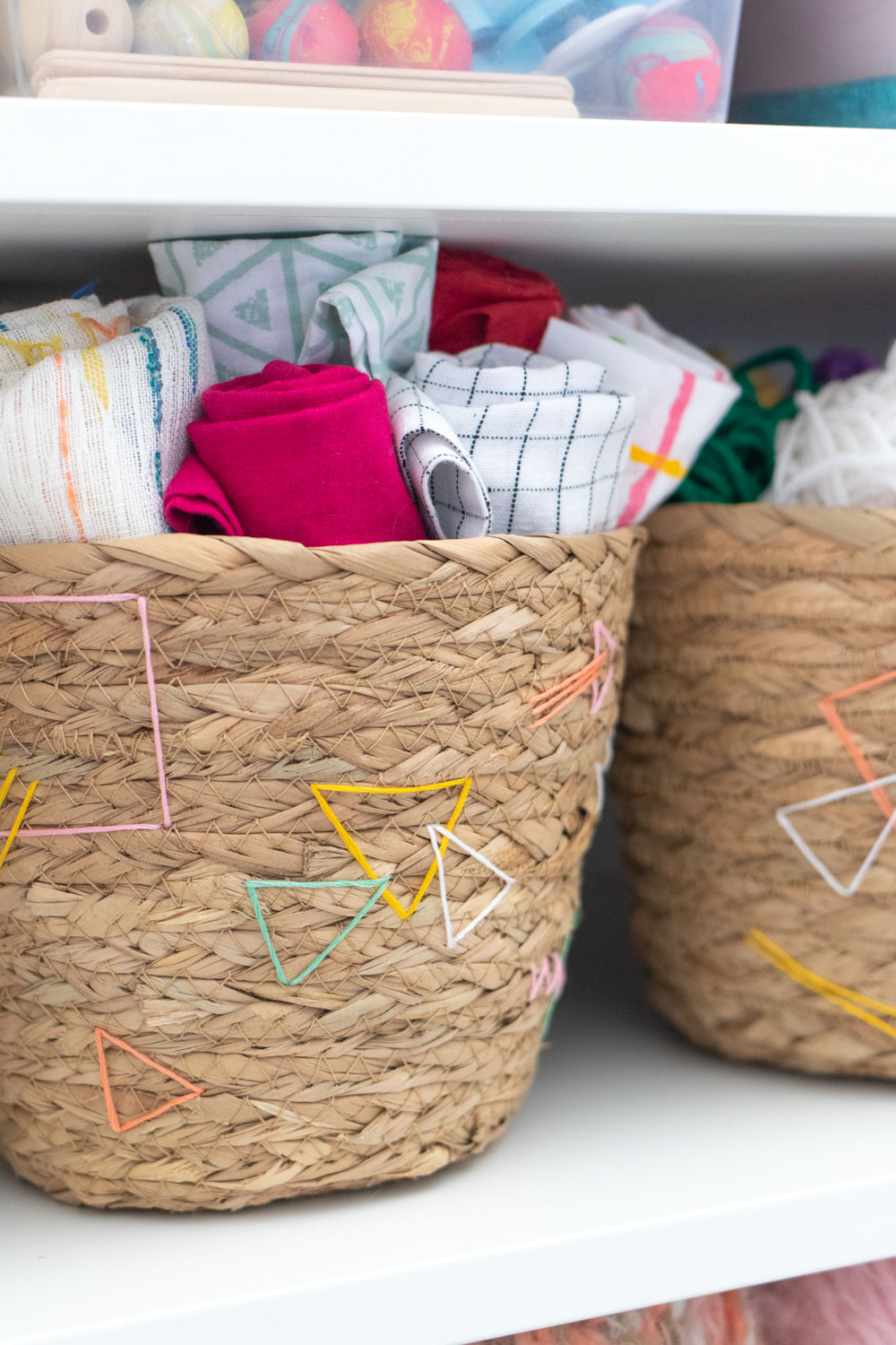closeup of embroidery detail on baskets
