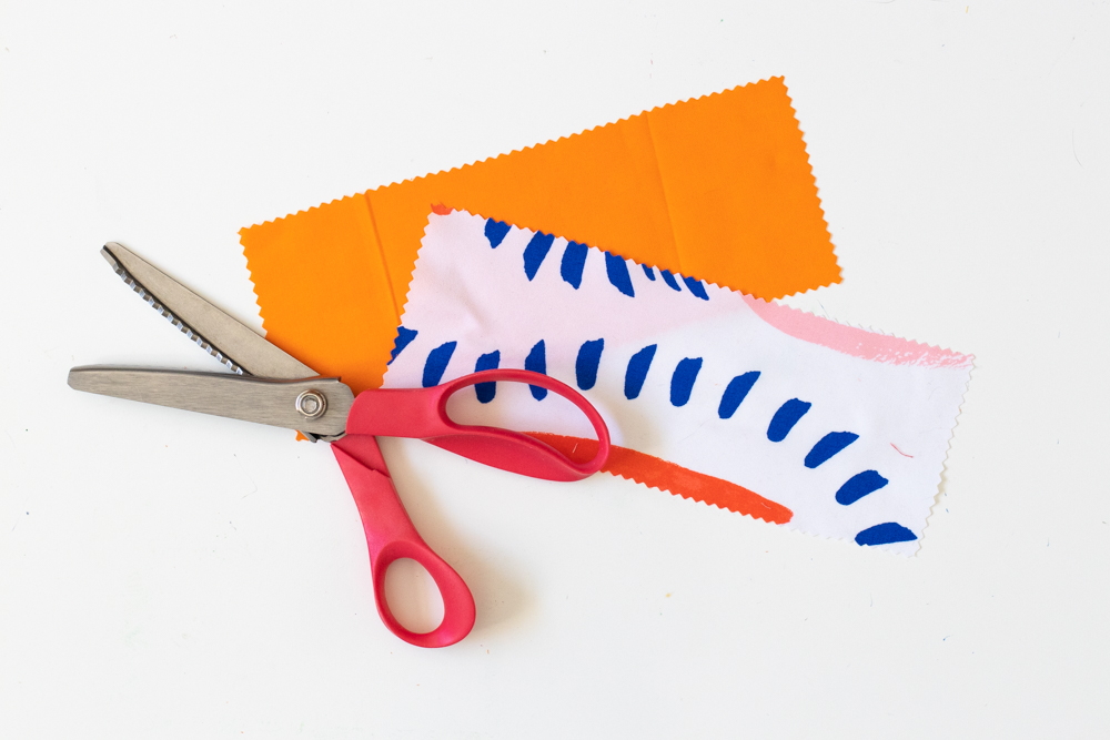patterned and orange fabric with pinking shears