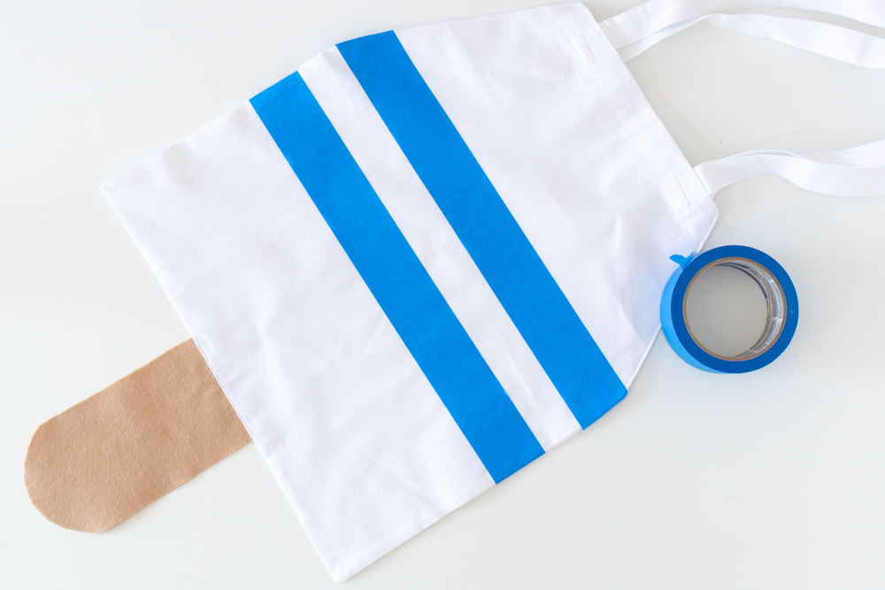 tape stripes on tote bag for painting