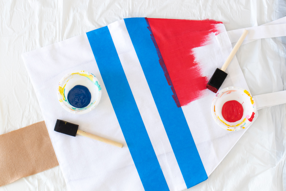 process of painting striped rocket pop tote bag