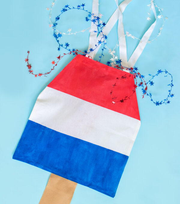 flatlay of rocket pop tote on blue with stars