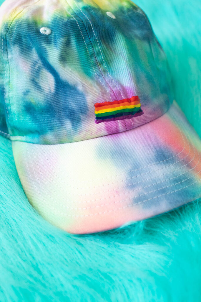 front view of DIY rainbow hat with pride flag