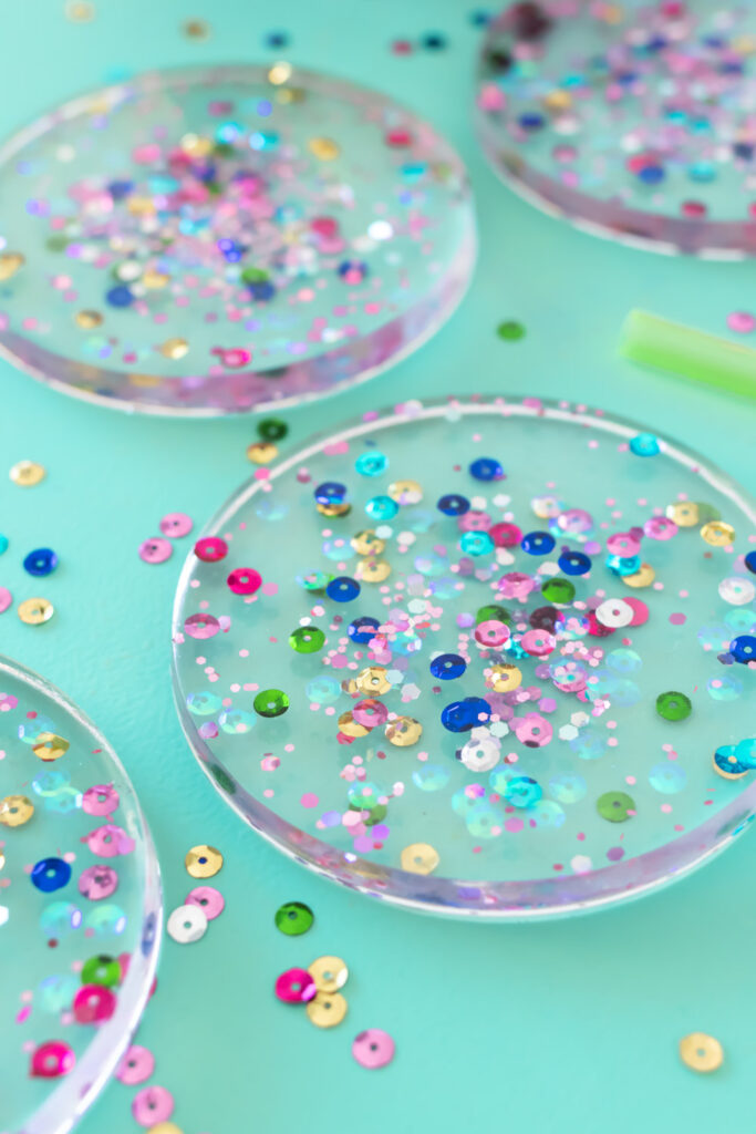 side view of confetti coasters with resin