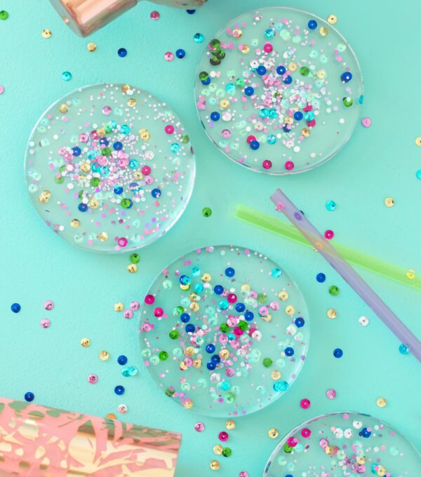 overhead view of four resin coasters with confetti inside