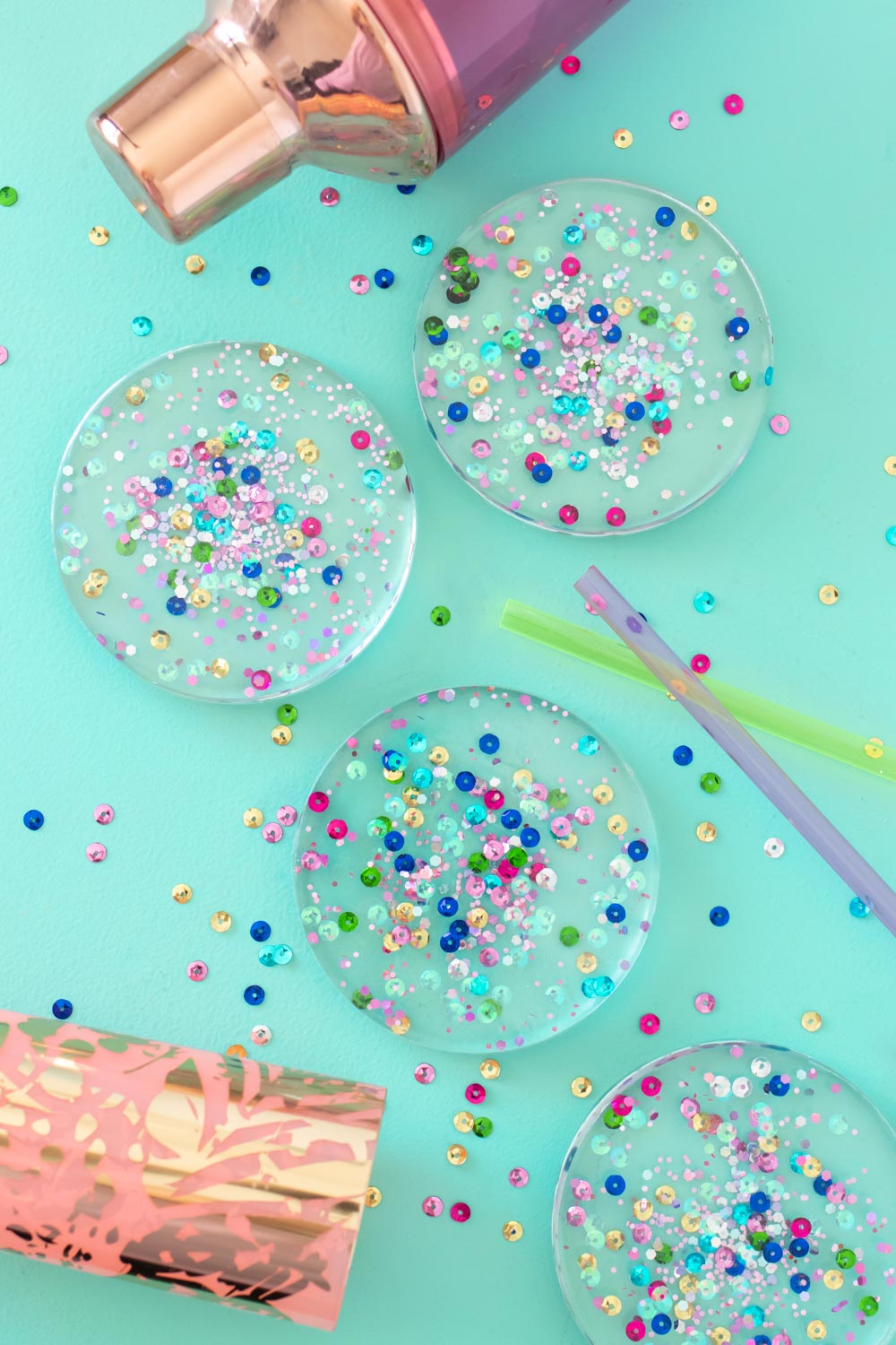 overhead view of four resin coasters with confetti inside