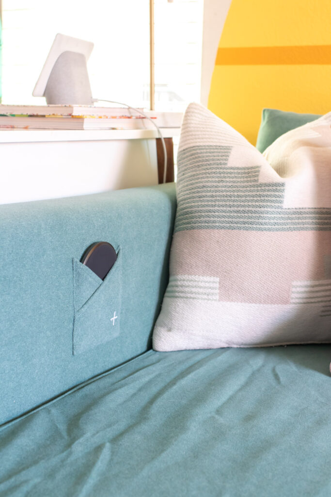 closeup of wireless charging in couch slipcover