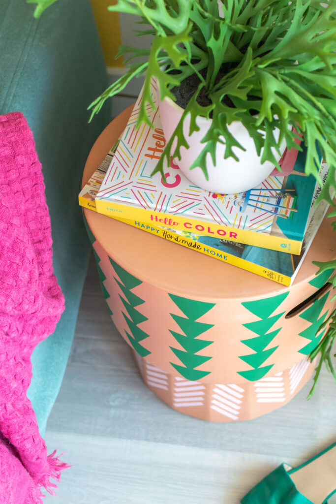 overhead view of DIY side table update with books and plant
