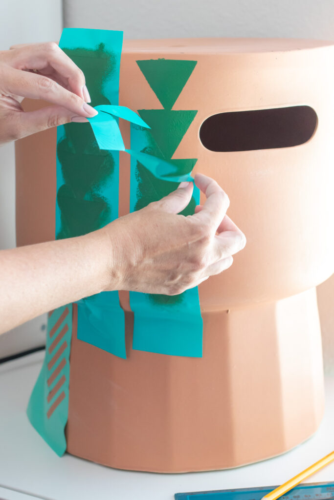 removing vinyl stencil on terracotta stool