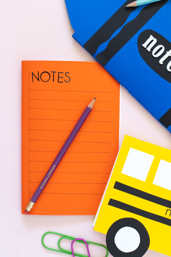 orange paper notebook decorated like notebook paper