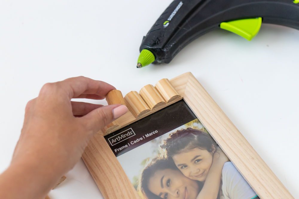 gluing wood trim pieces to picture frame