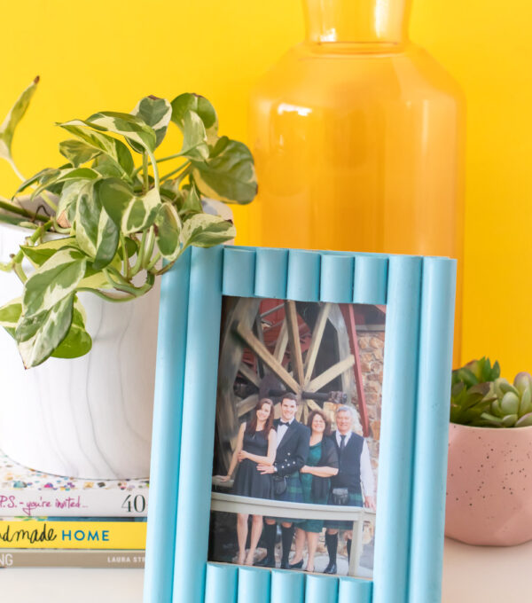 easy photo frame update with trim on table with plant