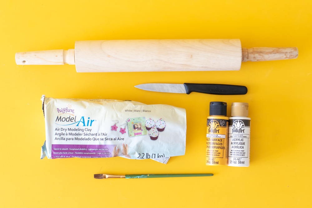 supplies for making clay catch-all dish on yellow background