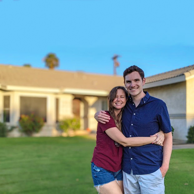 couple in front of first home