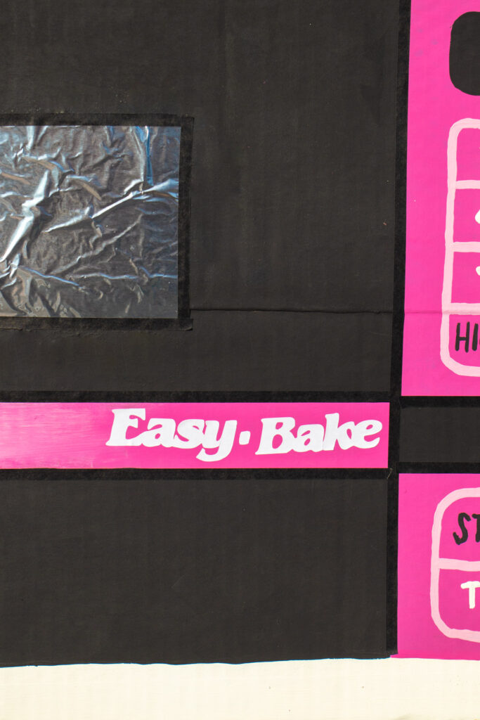 closeup of Easy Bake vinyl logo on 90s Halloween costume