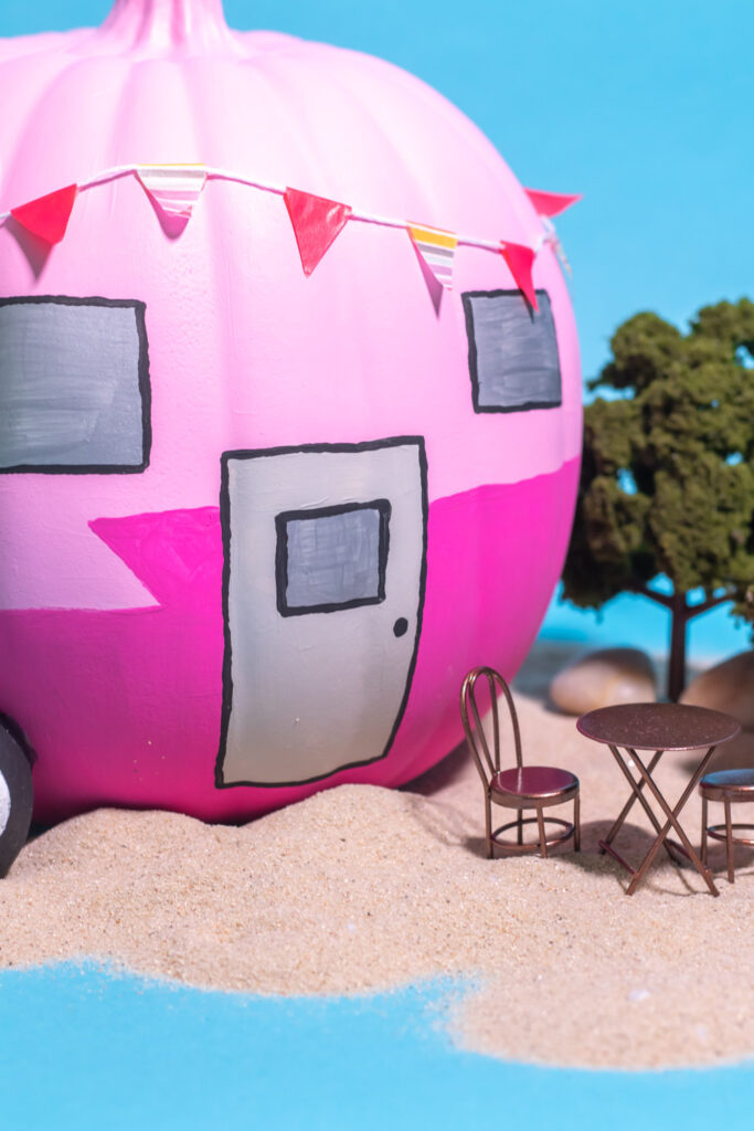 closeup of painted door on trailer pumpkin with small dinette set