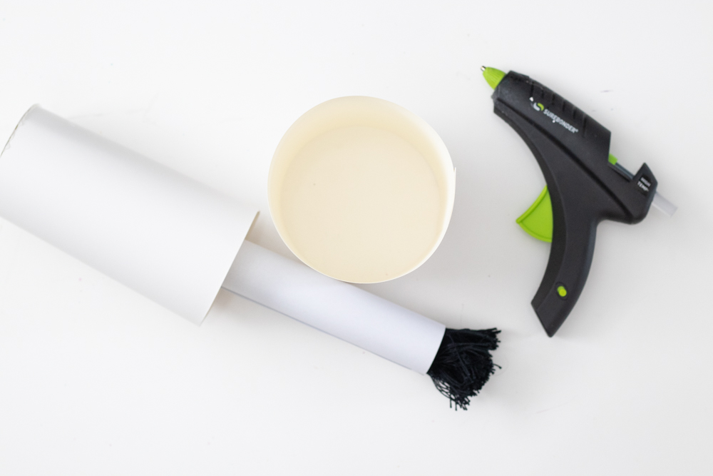 glue gun next to DIY nail polish brush with tassel