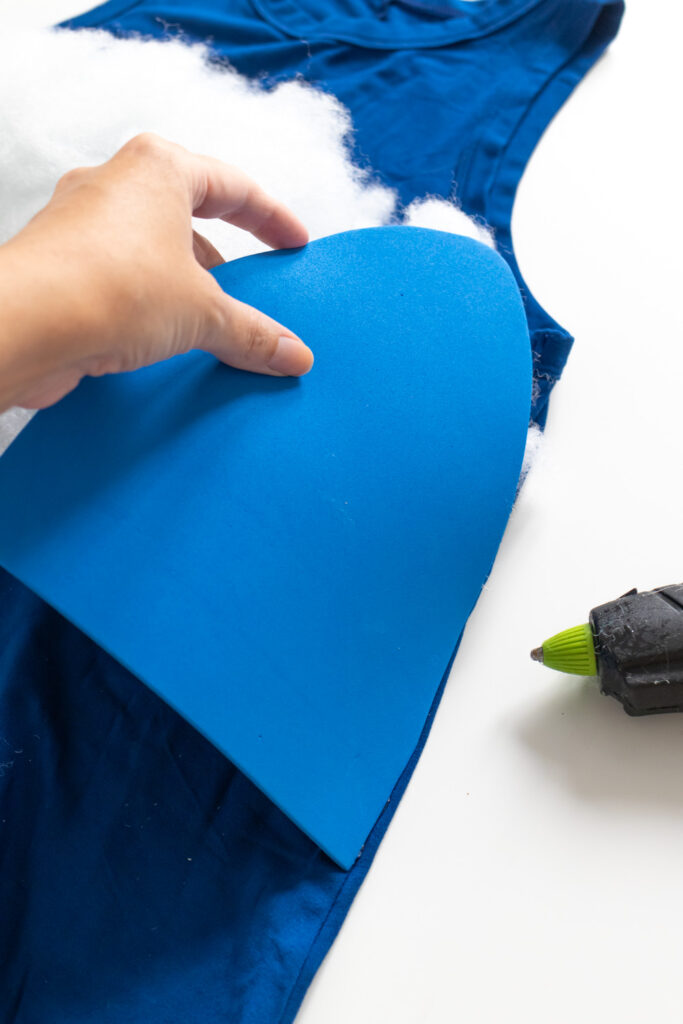 gluing foam applicator petals to a dress for tampon costume