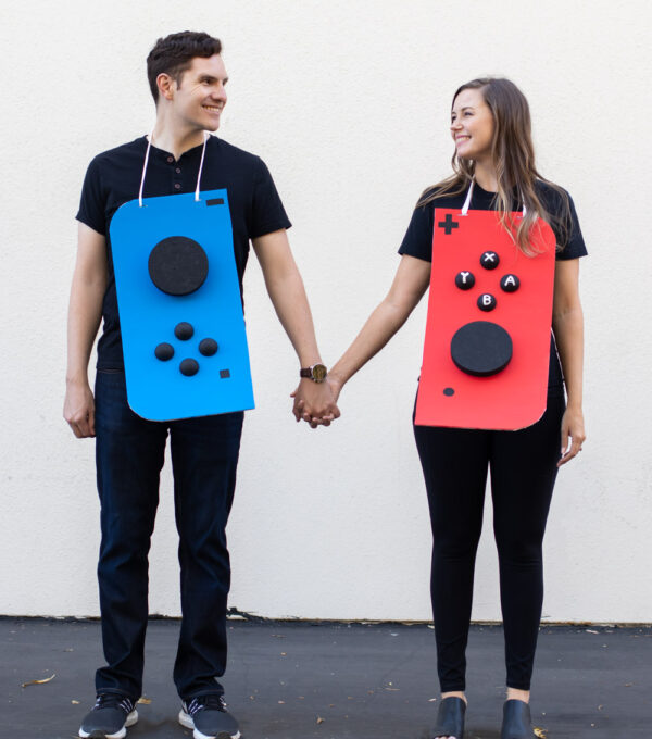 couple wearing Nintendo Switch costume against white background