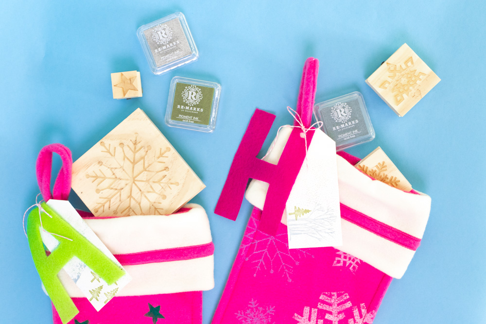 closeup of tops of custom stamped stockings with stamps and ink