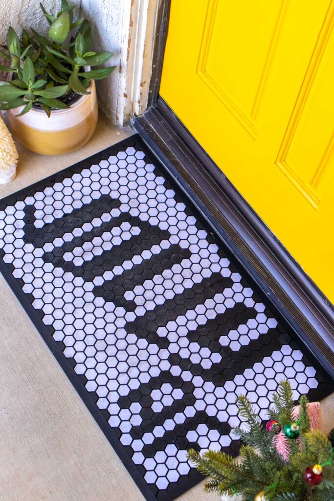 customizable doormat with holiday message in front of modernized front door