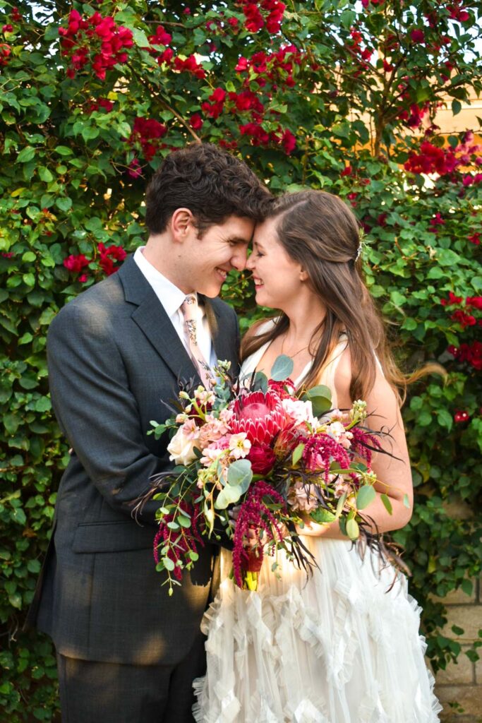bride and groom with flowers