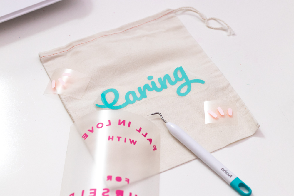 weeding and arranging vinyl on gift bag