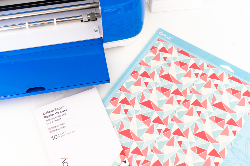applying patterned paper to Cricut mat