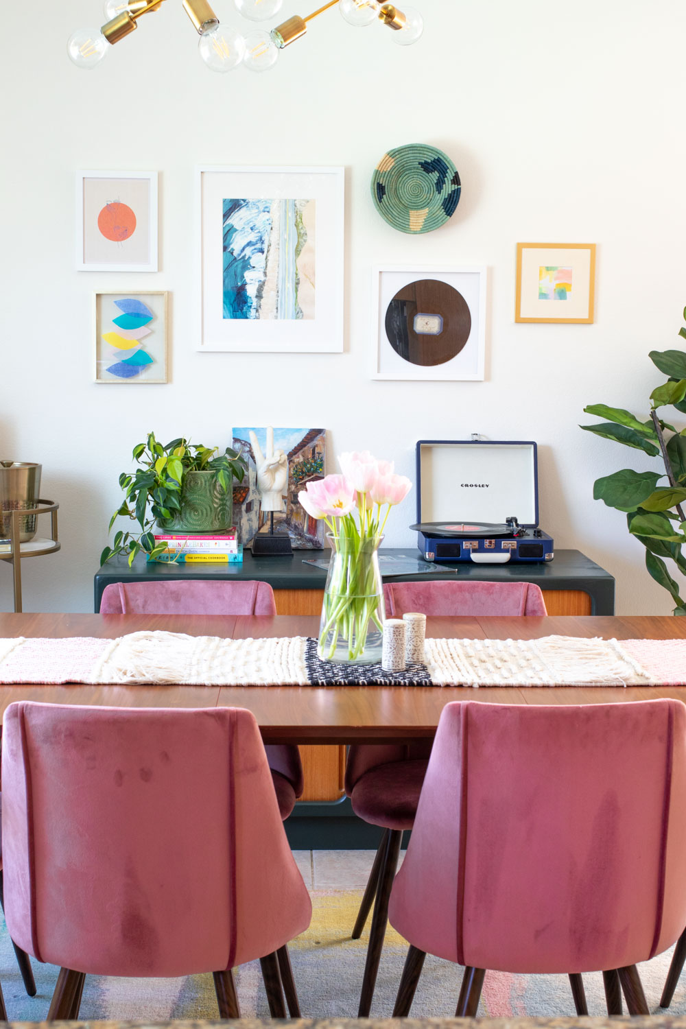 colorful dining room featuring wall art with tissue paper