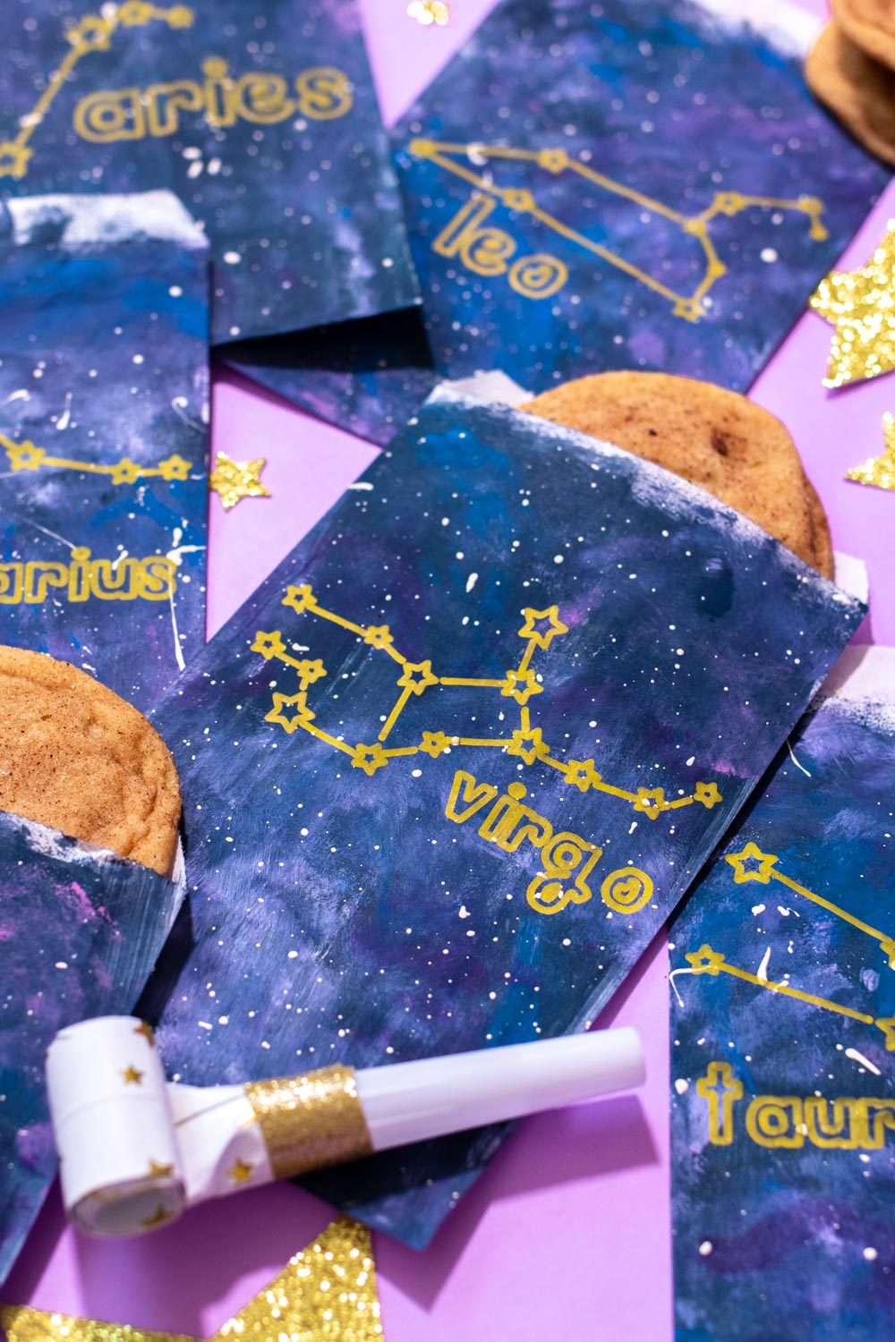 arrangement of zodiac treat bags for party with stars