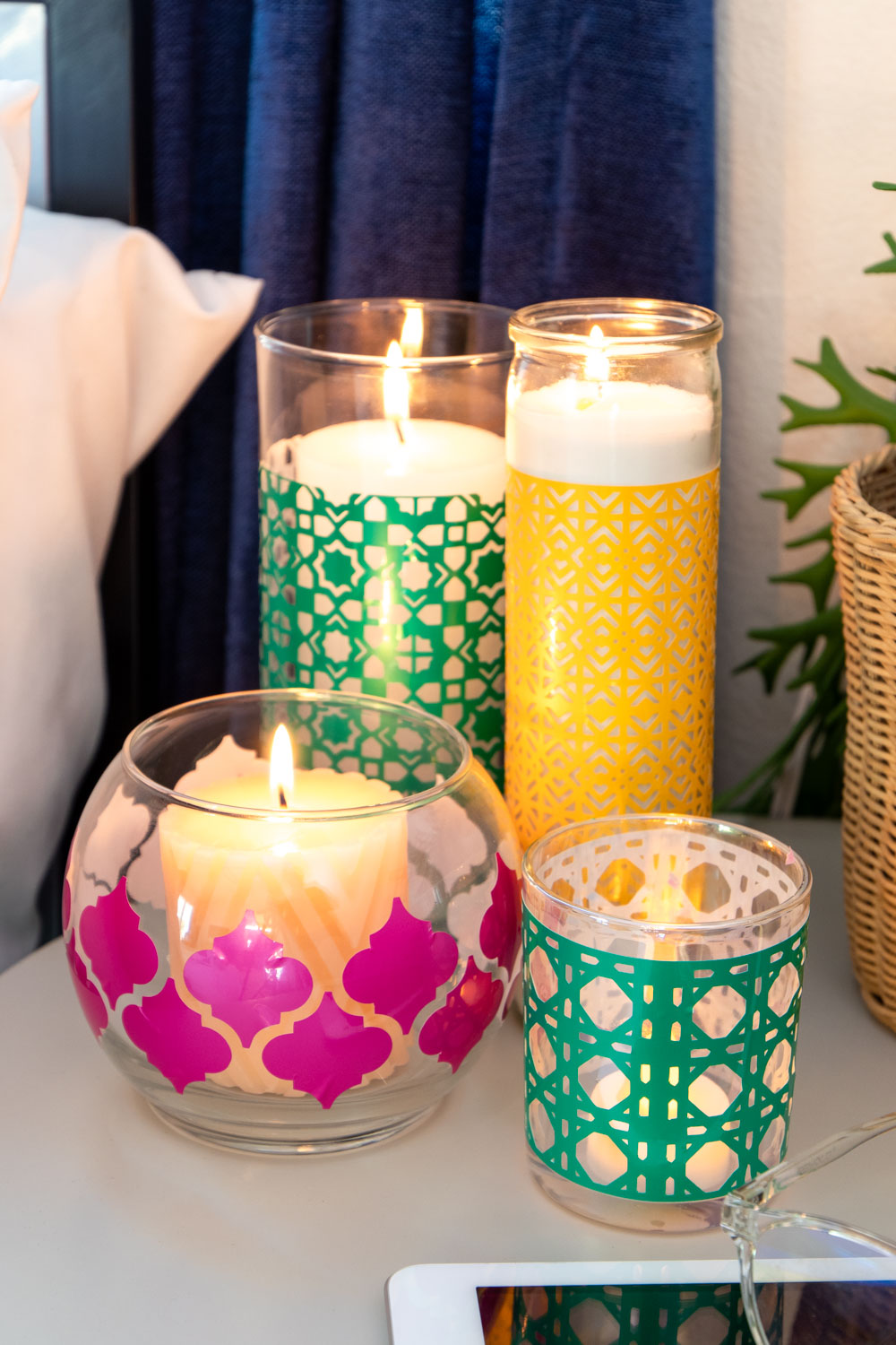 variety of colorful boho candleholders clustered in bedroom