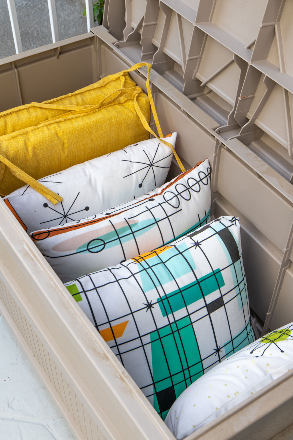 inside of deck box filled with pillows