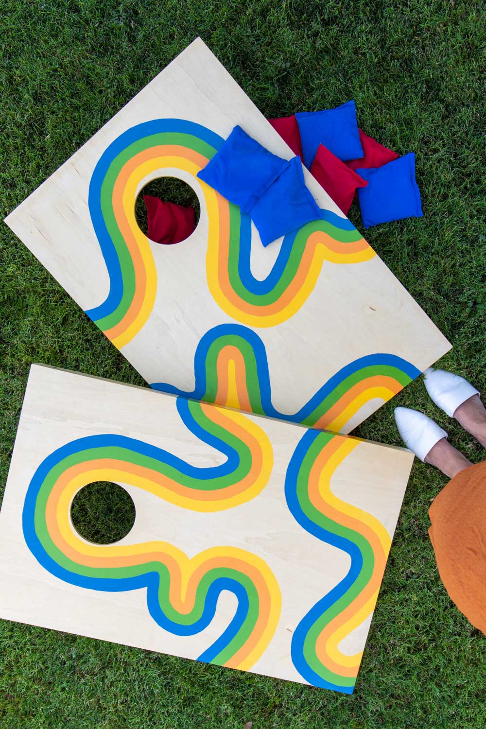 overhead view of cornhole makeover with painted retro design