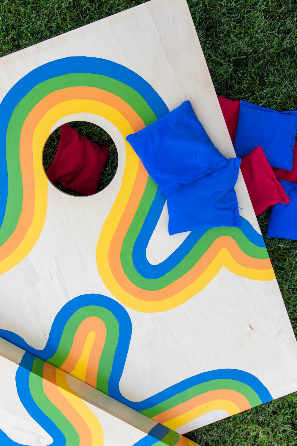 cornhole makeover in grass with beanbags