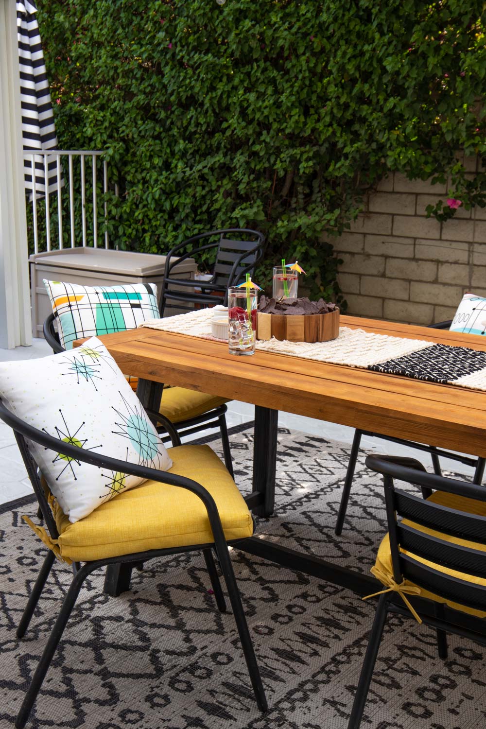 backyard oasis with table, chairs and decor from wayfair