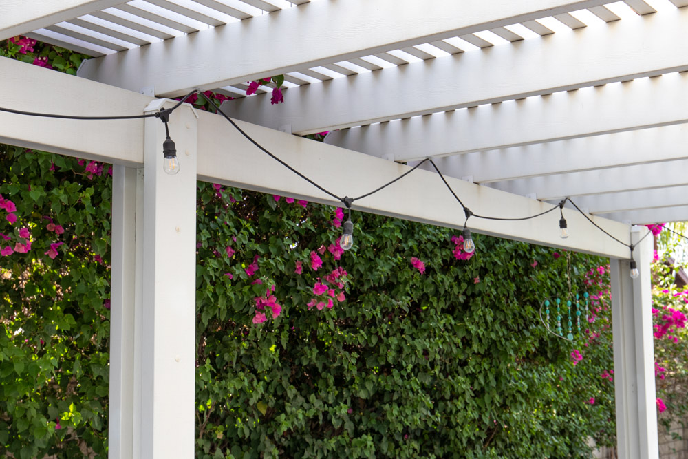 market lights hanging from pergola